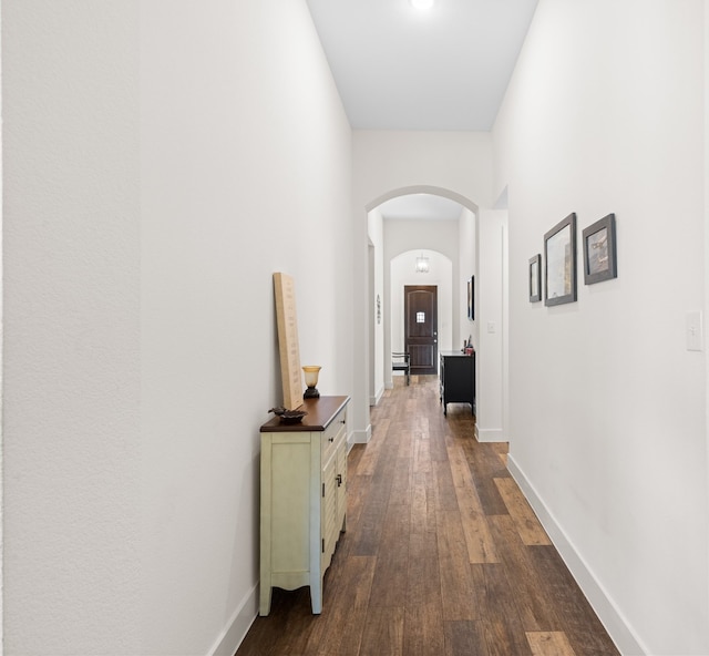 hallway featuring dark wood-type flooring