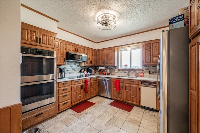 kitchen with backsplash, stainless steel appliances, ornamental molding, and sink