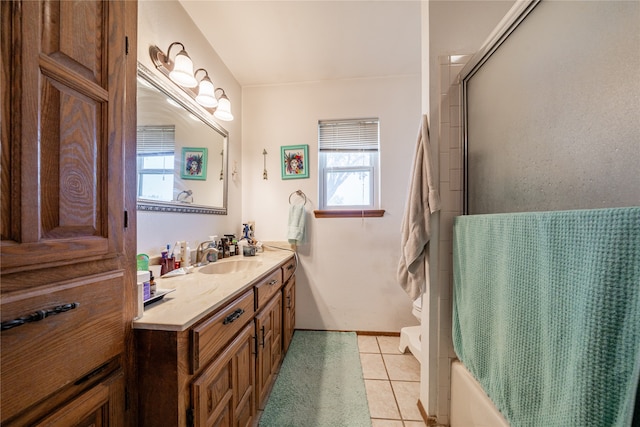 full bathroom with vanity, shower / bath combination with glass door, toilet, and tile patterned floors