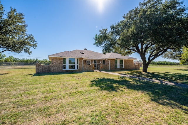 ranch-style house with a patio area and a front yard