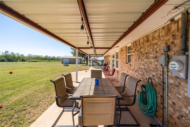 view of patio with a shed