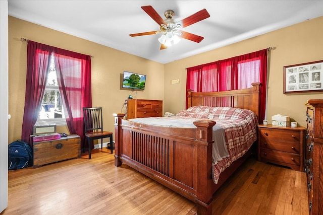 bedroom with hardwood / wood-style flooring and ceiling fan