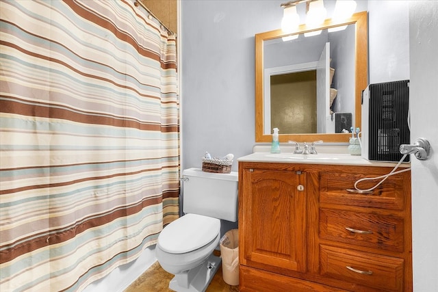 bathroom featuring toilet, a shower with curtain, and vanity