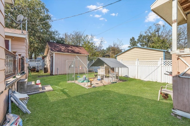 view of yard featuring a storage shed and a patio area