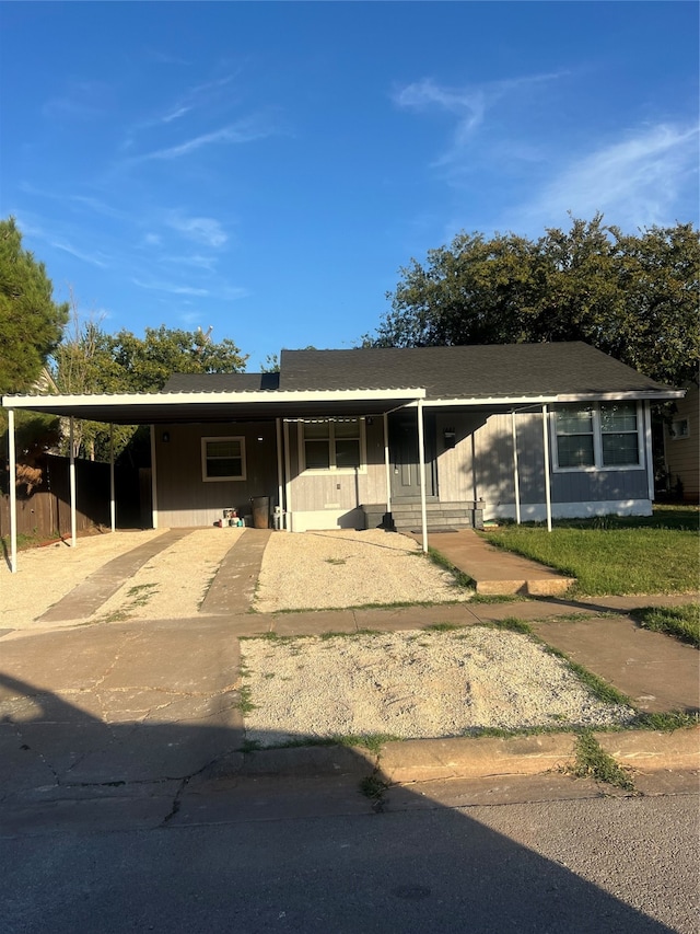 view of front of home with a carport