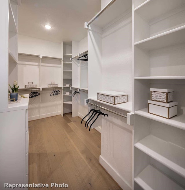 spacious closet featuring light wood-type flooring