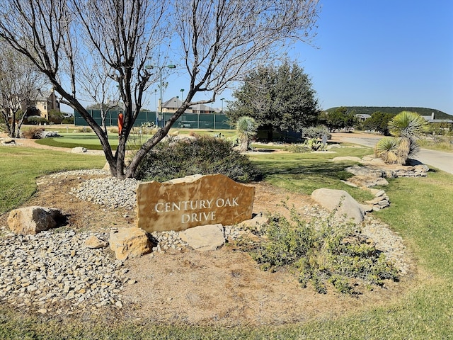 view of home's community featuring a lawn