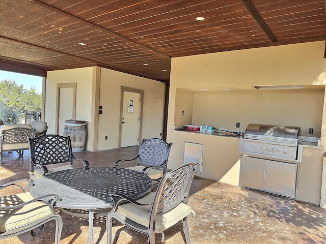 view of patio / terrace featuring area for grilling and a grill