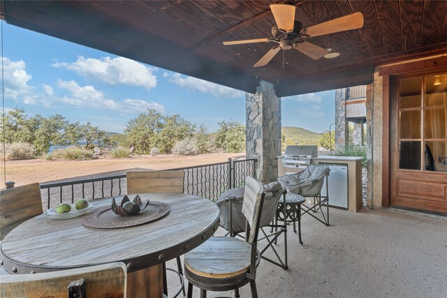 view of patio / terrace featuring grilling area, a mountain view, area for grilling, and ceiling fan