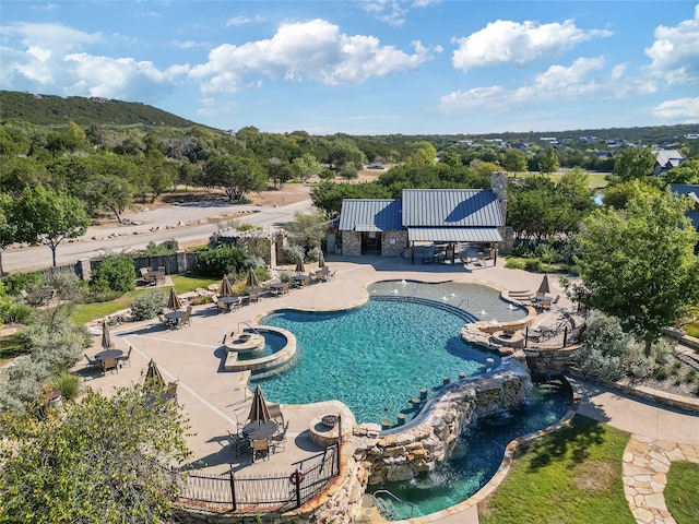 view of swimming pool with a gazebo, a patio area, and pool water feature