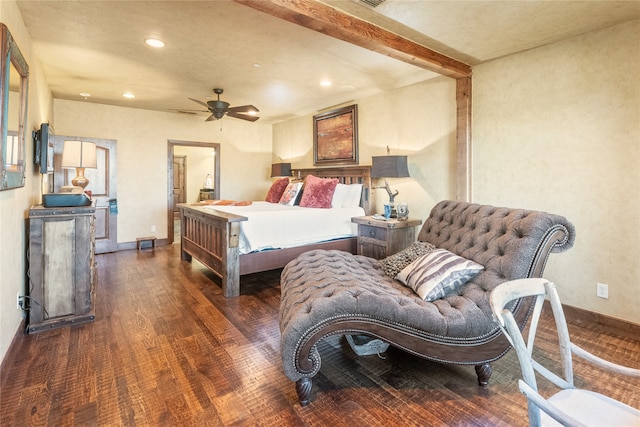 bedroom with beamed ceiling, dark hardwood / wood-style floors, and ceiling fan