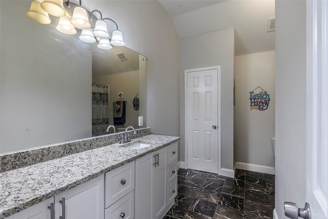 bathroom featuring a shower with curtain and vanity