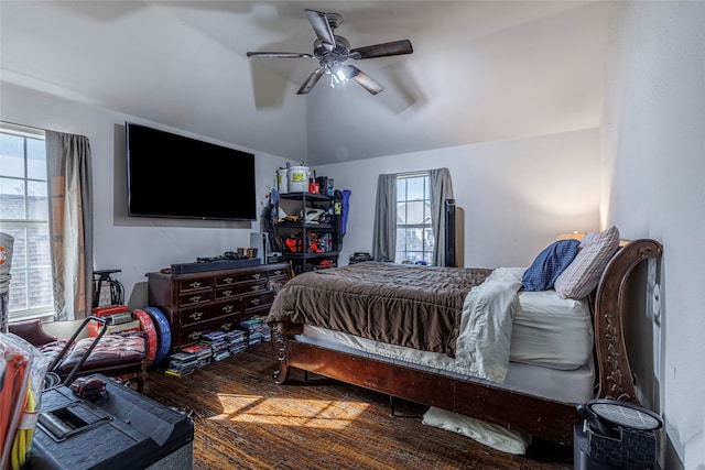 bedroom featuring hardwood / wood-style flooring, vaulted ceiling, and ceiling fan