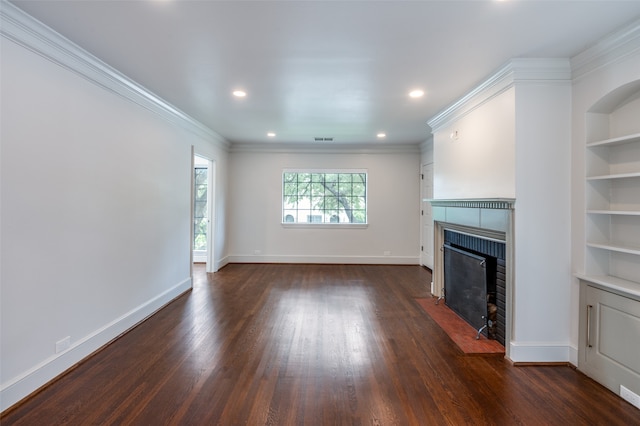 unfurnished living room with built in shelves, crown molding, and dark hardwood / wood-style floors