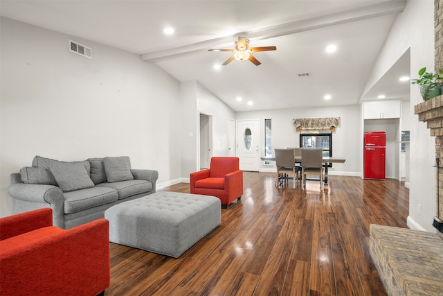 living room featuring ceiling fan, dark hardwood / wood-style flooring, vaulted ceiling with beams, and a fireplace