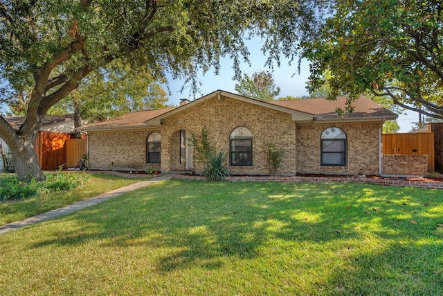 ranch-style house with a front yard