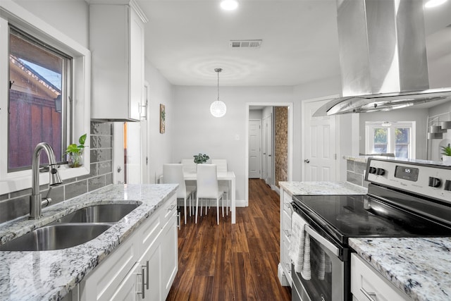 kitchen featuring white cabinetry, extractor fan, sink, and stainless steel range with electric cooktop