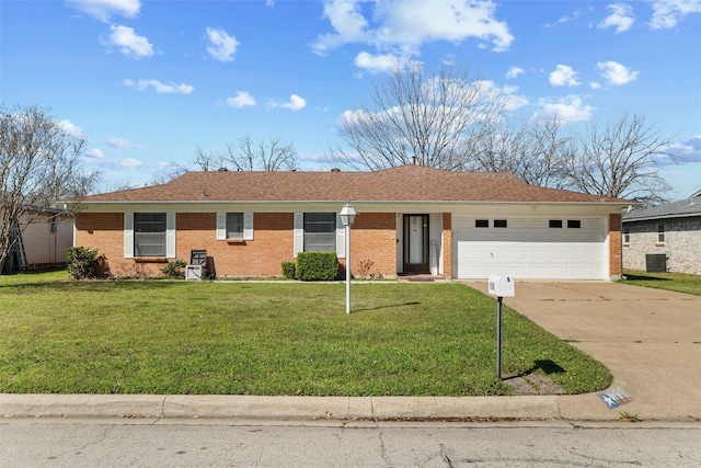 ranch-style house featuring a front lawn, an attached garage, brick siding, and driveway