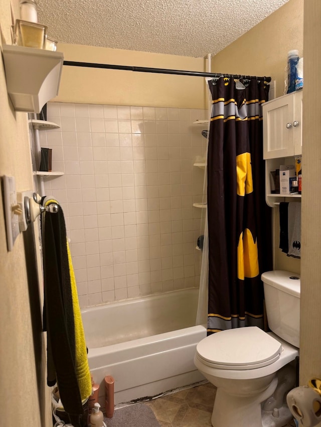 bathroom featuring shower / bath combination with curtain, toilet, and a textured ceiling