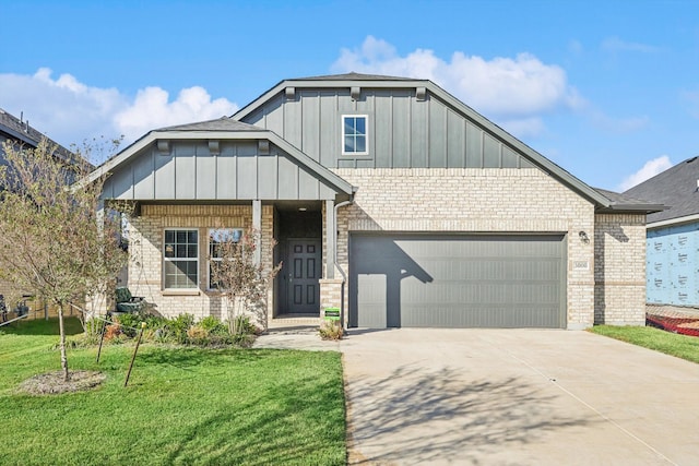 view of front of house with a front yard and a garage