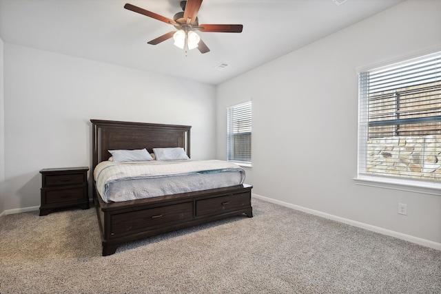 bedroom featuring ceiling fan and light carpet