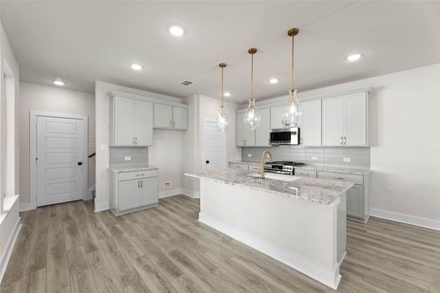 kitchen with custom exhaust hood, backsplash, appliances with stainless steel finishes, dark wood-type flooring, and gray cabinets