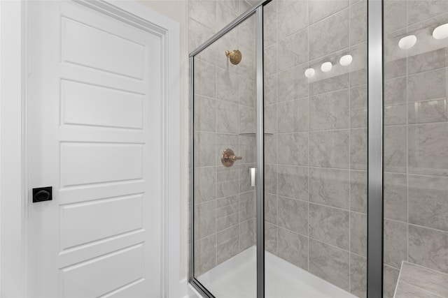 bathroom featuring a shower stall