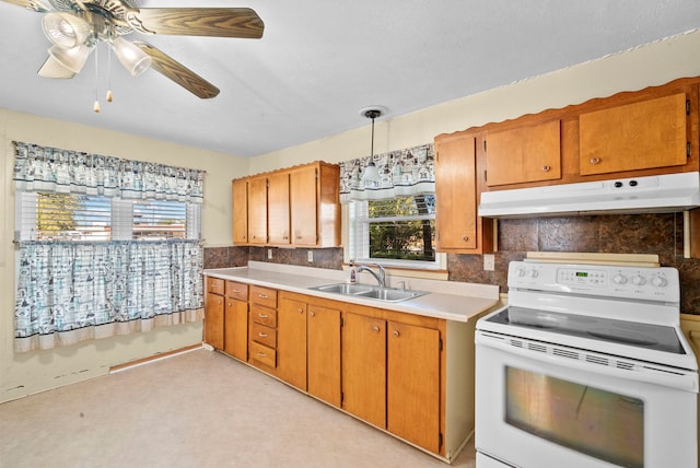 kitchen with sink, ceiling fan with notable chandelier, light carpet, decorative light fixtures, and white electric range oven