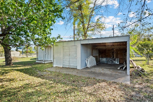 view of outbuilding with a yard