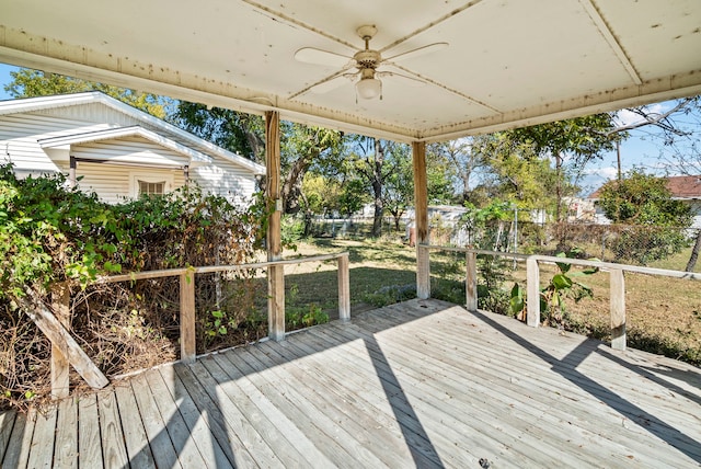 wooden terrace featuring ceiling fan