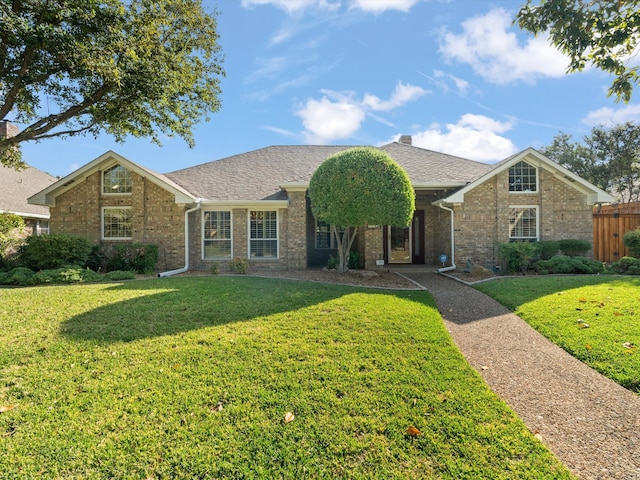 single story home featuring a front lawn