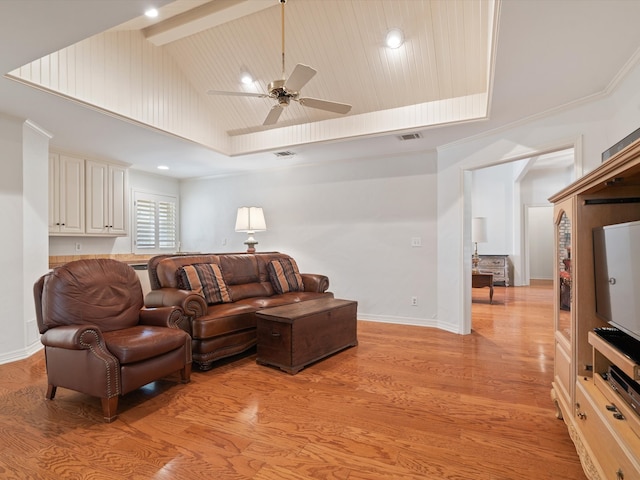 living room featuring ceiling fan, high vaulted ceiling, beamed ceiling, and light wood-type flooring