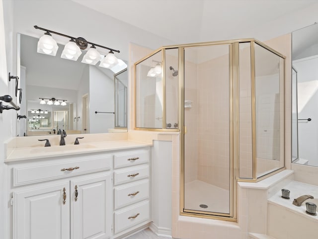 bathroom with vanity and a shower with shower door