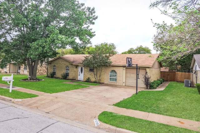 ranch-style house with a front yard and central AC unit