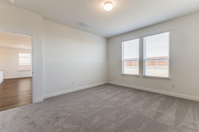 unfurnished room featuring carpet floors