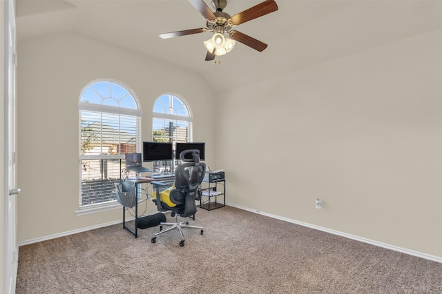 carpeted office with ceiling fan and vaulted ceiling