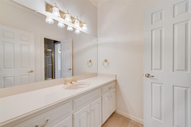 bathroom with vanity, walk in shower, and ornamental molding