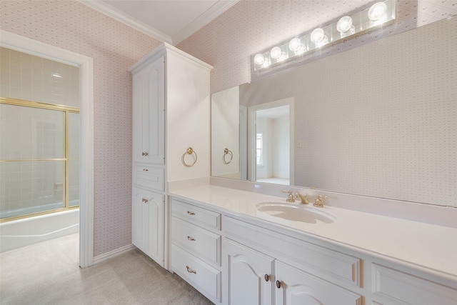 bathroom with vanity, ornamental molding, and bath / shower combo with glass door