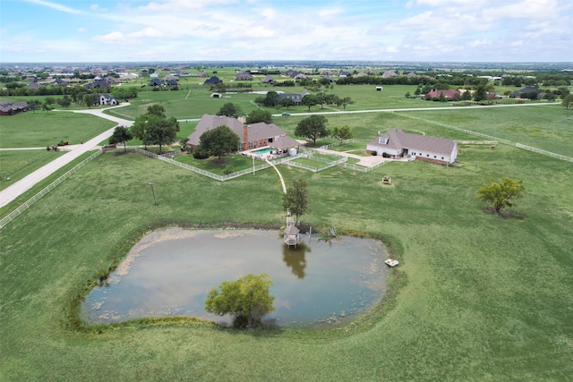 drone / aerial view with a water view and a rural view