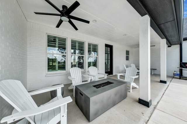 view of patio / terrace with a fire pit and ceiling fan