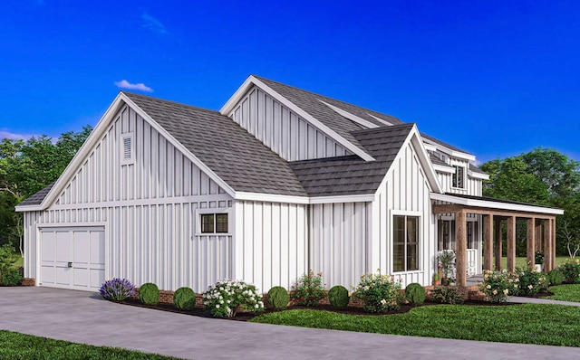 view of side of property featuring a lawn and a garage