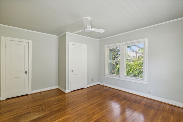 unfurnished room featuring ornamental molding, dark wood-type flooring, and ceiling fan