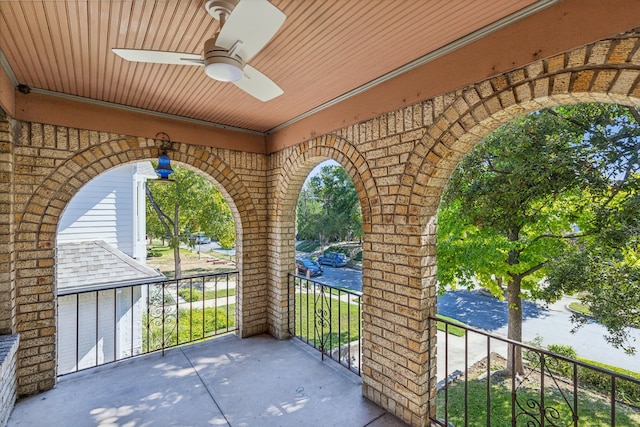 view of patio with a balcony and ceiling fan