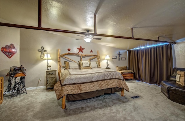 carpeted bedroom featuring lofted ceiling, a textured ceiling, and ceiling fan