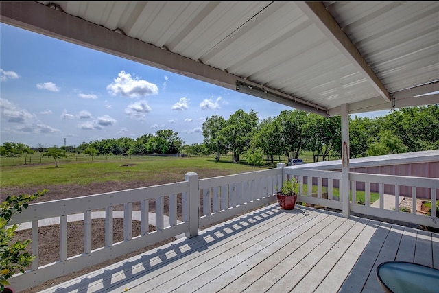 deck featuring a rural view and a yard