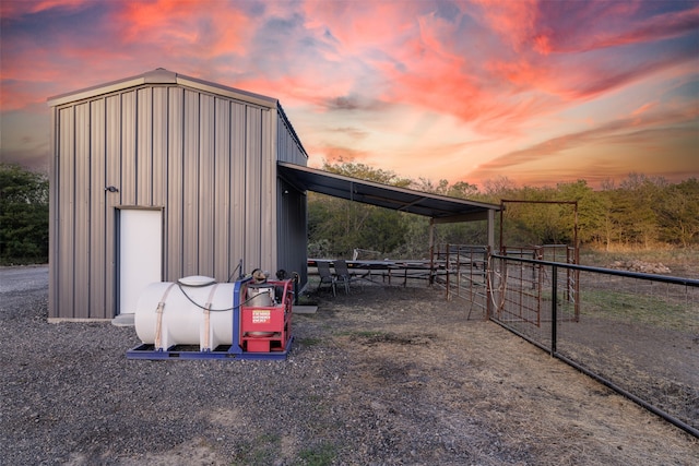 view of outdoor structure at dusk