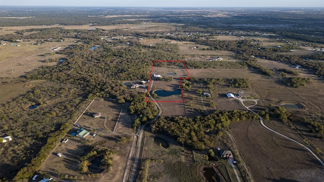 birds eye view of property with a rural view