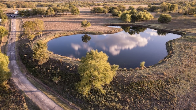 birds eye view of property featuring a water view and a rural view