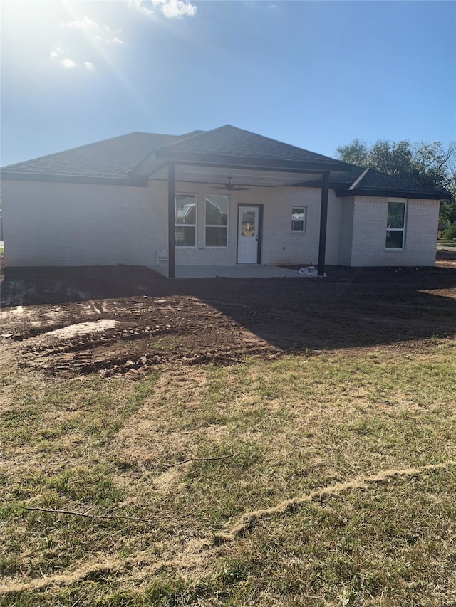 view of front of property with a front yard and a patio area