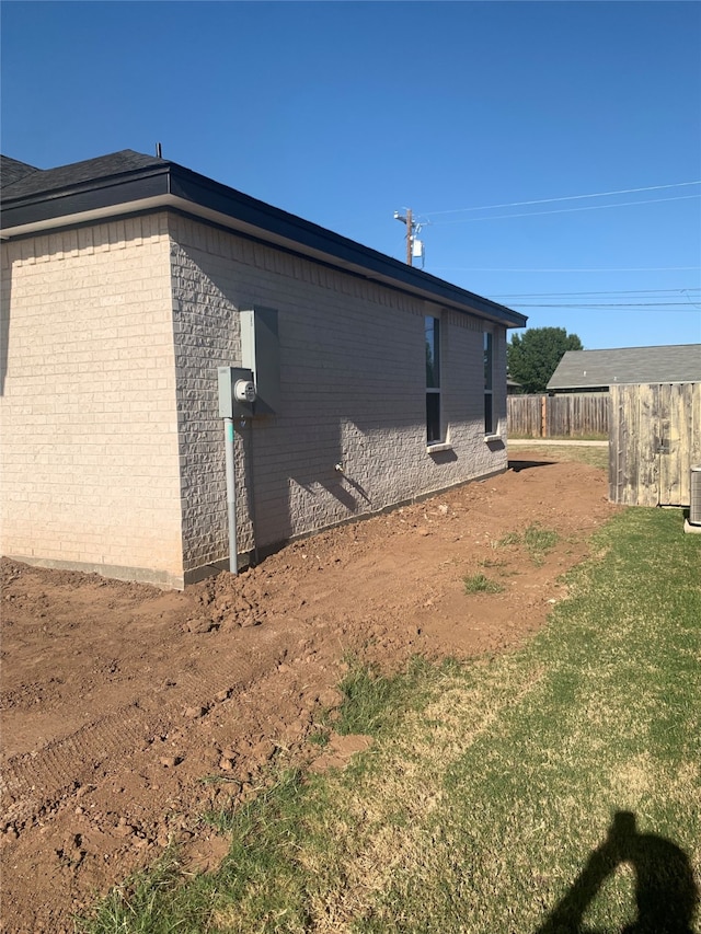 view of property exterior featuring a lawn